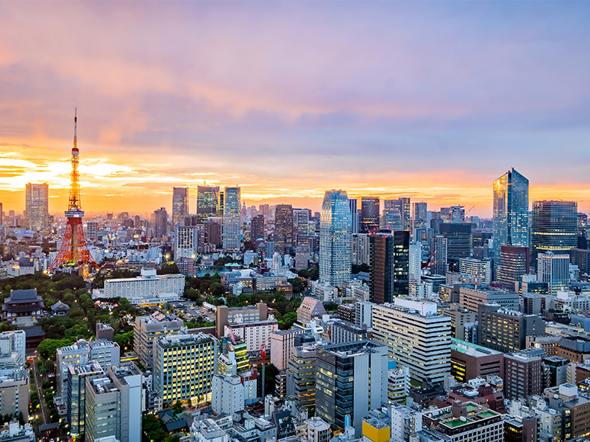 Aerial view of Tokyo skyline at sunset featuring Tokyo Tower