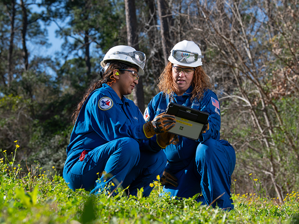 Two LYB employees working outdoors committed to proactive environmental management