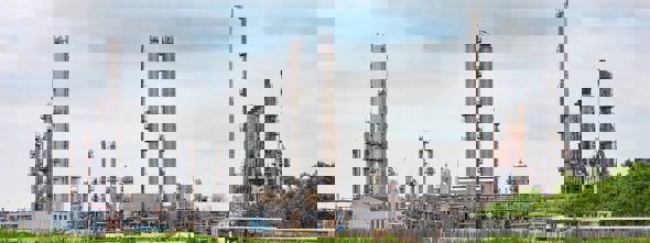 Petrochemical facility with tall distillation towers