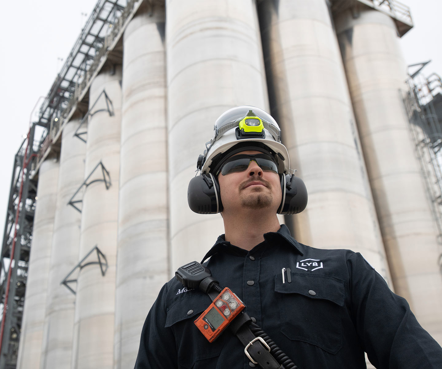 LYB employee standing in front of storage columns