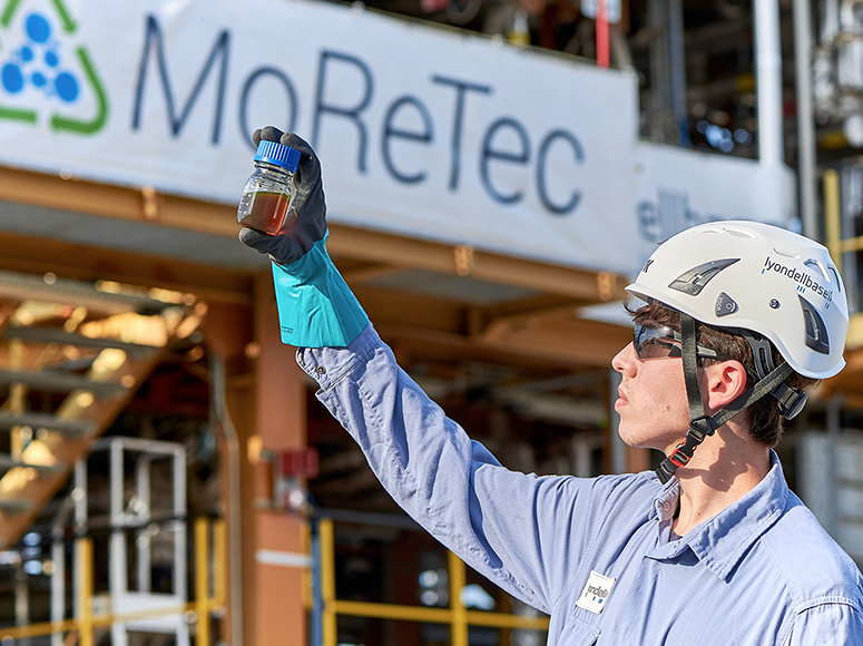 LYB MoReTec employee with bottle