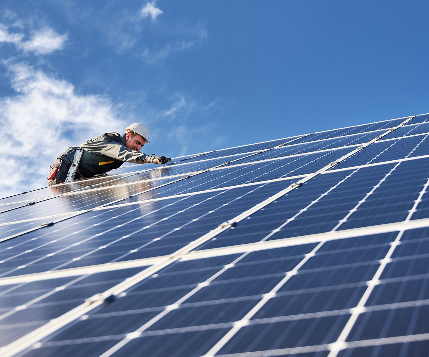 Technician installing solar panels