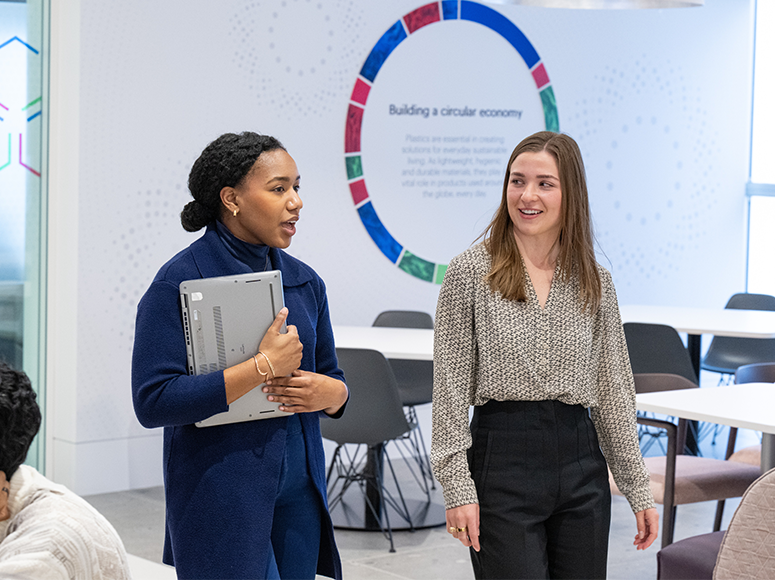 Employees speaking in employee lounge